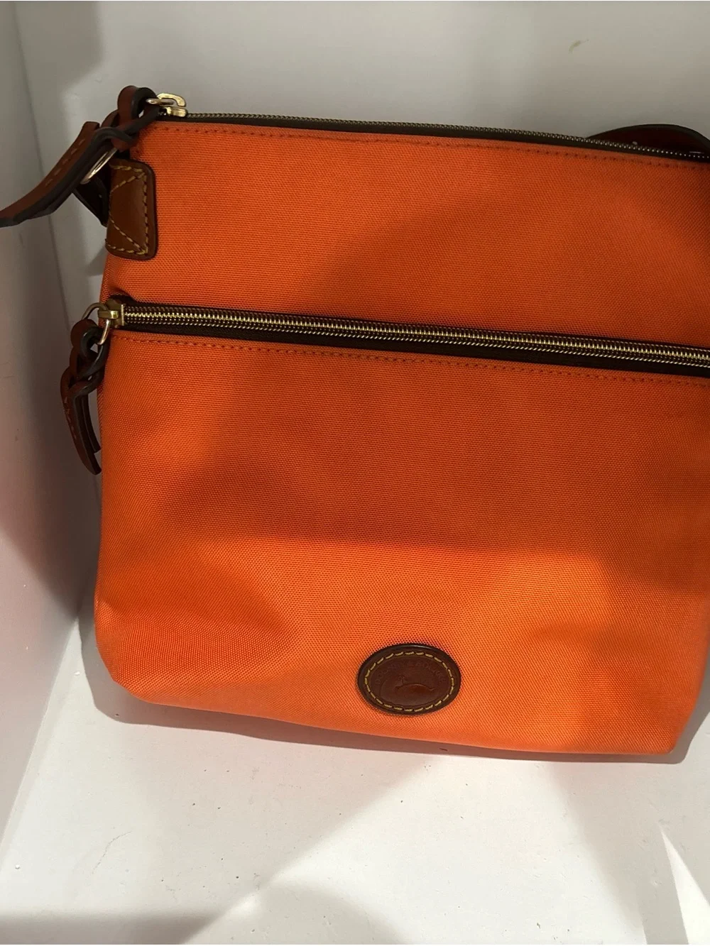 Dooney & Bourke Bright Orange Crossbody with Brown Leather Strap
